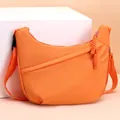 Fashionable orange oxford crossbody bag for women with woven zipper pull details - One Size / Orange