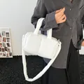 Stylish white padded puffer handbag with shoulder strap, minimalist quilted design - White