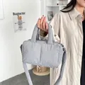 Trendy minimalist gray puffer tote bag with quilted texture and soft top handle - Gray