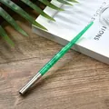Elegant green starry resin dip pen with a silver metal ferrule on a rustic wooden desk - Green Starry Texture Barrel (WD175004)