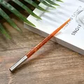 Handcrafted amber resin dip pen with silver metal ring grip on aesthetic wooden desk - Amber Starry Texture Barrel (WD175019)