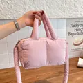Pink puffer quilted tote bag featuring soft padding and adjustable shoulder strap - Pink