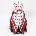 Close-up of a red and white polka dot silk scarf styled as a headscarf on a model. - 70*70cm / FH179-03# Red