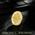 Vintage gold oval metal wax seal stamp head with ornate letter E design size 29x23mm - Letter E