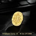 Vintage gold metal wax seal stamp head featuring ornate letter M design 29x23mm - Letter M