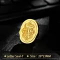 Vintage golden metal wax seal head with engraved letter T floral design - Letter T