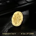 Vintage golden metal wax seal stamp head featuring baroque style letter V design - Letter V
