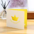 Elegant creative hollow greeting card with crown cutout design in white and yellow. - Crown Card (GA146)