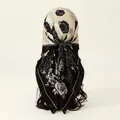 Detail showing back styling of an elegant black and white rose floral satin square scarf - Black (FH075-1#)