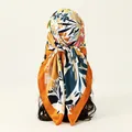 Detailed view of floral satin square scarf tied as a headscarf on a mannequin head - Beige Background Floral Pattern / 90x90cm / Light Green (FH070-3#)