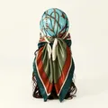 Back view of a premium silk-like square scarf with chain print tied as a headscarf. - Green (FH071-4#)
