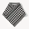 Detailed view of the black and white houndstooth knitted pattern on the neck gaiter. - 35*32cm / Black and White