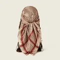 Detailed view of a soft lattice patterned satin headscarf wrapped on a mannequin head - Coffee / 91x91cm