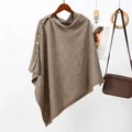 Macro detail of brown knitted poncho featuring stylish gold buttons and soft wool-like texture. - 144x62CM / Khaki