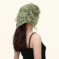 Detail shot of a French vintage green lace triangle headscarf with floral embroidery - 94*32cm / Green