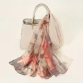 Elegant floral print chiffon scarf draped on a cream bag in soft pink and brown tones - Floral Print Style (YSY071-5)