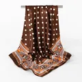 Detailed view of brown polka dot satin square scarf, showing smooth texture and geometric border. - Coffee / 90x90cm