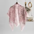 Elegant pink floral print voile square scarf hanging on a wooden hanger for women - Nude Pink