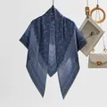 Elegant blue Bali gauze square scarf featuring delicate floral prints and scalloped edges - Sapphire Blue