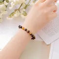 Elegant natural tiger's eye beaded bracelet for women with golden spacer accents - Tiger Eye Stone Bracelet