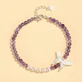 Elegant purple crystal and freshwater pearl bracelet featuring a silver butterfly pendant. - Amethyst Freshwater Pearl Shell Butterfly Bracelet