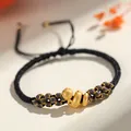Handmade woven black and grey bracelet with a golden lucky snake charm for Year of the Snake - Lucky Snake Peach Blossom Knot / Black