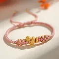 Pink hand-braided peach knot bracelet with golden snake charm, Year of the Snake jewelry - Lucky Snake Peach Blossom Knot / Pink