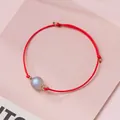 Handmade red string bracelet with single iridescent crystal bead and gold accents. - Rainbow Moonstone - Red Rope