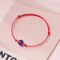 Handmade adjustable red string bracelet featuring a round purple amethyst bead - Uruguay Amethyst - Red Rope