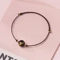 Handmade minimalist brown braided cord bracelet featuring a gold-sheen obsidian bead. - Gold Sheen Obsidian - Black Rope