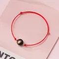 Handmade minimalist red string bracelet featuring a golden sheen bead and gold accents - Gold Sheen Obsidian - Red Rope