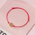 Handmade red braided rope bracelet featuring a clear crystal bead with gold rutile - Gold Rutilated Quartz - Red Rope