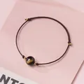 Hand-woven brown rope bracelet featuring a dark bead with golden sheen for women - Gold Sheen Obsidian - Brown Rope