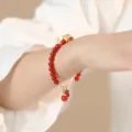 Natural red Nanhong agate bead bracelet with delicate golden charms for women - Agate Bow Style