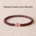 Handmade natural garnet beaded bracelet with a rose quartz center and gold accents - Garnet Strawberry Quartz Bracelet