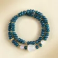 Double-wrapped blue-green chalcedony beaded bracelet with a white carved fox charm. - Chalcedony Nine-tailed Fox Style