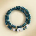 Double-layer teal chalcedony beaded bracelet with white carved fox charm jewelry piece. - Chalcedony Bear Agate Style