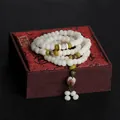 Natural white Bodhi root 108 prayer beads bracelet with lotus charm on a red gift box - Style with Skin (108 Beads) / 6X8mm / Cream