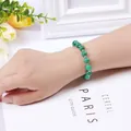 Fashionable green stone beaded bracelet featuring silver spacers displayed on a wrist - Chrome Diopside Bracelet (Silver Color)