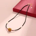 Neo-Chinese style necklace with black faceted beads, pearls, and golden lacquer focal bead. - Black Spinel Freshwater Pearl Lacquer Bead Necklace / Black