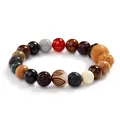 Handcrafted 18-seed Buddhist bead bracelet featuring varied natural wood and stone textures - Lotus 18 Seeds