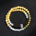 Elegantes zweireihiges Katzenaugen- und Sandelholzperlenarmband mit weißem Donut-Anhänger für Damen - Weißes Katzenauge Alashan Sandelholz