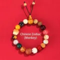 Traditional 18-seed Buddha beaded bracelet with mixed natural wood and stone beads - Zodiac Monkey