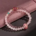 Handmade double-strand pink crystal bracelet with a ping'an kou charm and turquoise - Rose Quartz Strawberry Quartz Safety Button Bracelet