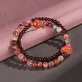 Double-layered strawberry quartz and garnet beaded bracelet with orange donut charm - Red Hematoid Garnet Safety Button Bracelet