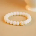 White Bodhi root beaded bracelet featuring a cute orange cat paw bead detail. - Round Bead Cat Paw Style / Single Loop Style / Cream