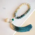 Elegant natural gradient Bodhi root prayer bead bracelet featuring a stylish teal tassel detail - Gradient Bodhi - Li'an Handheld - Square Beads / Multi-loop/Handheld Style / Gradient Dark Green