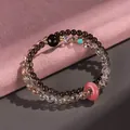 SKU: Double-layer beaded bracelet with pink donut charm and strawberry quartz beads. - Black Gold Super Seven Smoky Quartz Bracelet