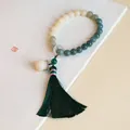 Natural Bodhi root bracelet featuring dark green tassel and lotus charm for women - Gradient Bodhi - Sijin Handheld - Round Beads / Multi-loop/Handheld Style / Gradient Dark Green