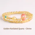 Double-layered rutilated quartz and citrine beaded bracelet with pink ping an kou charm. - Rutilated Quartz Safety Button Bracelet